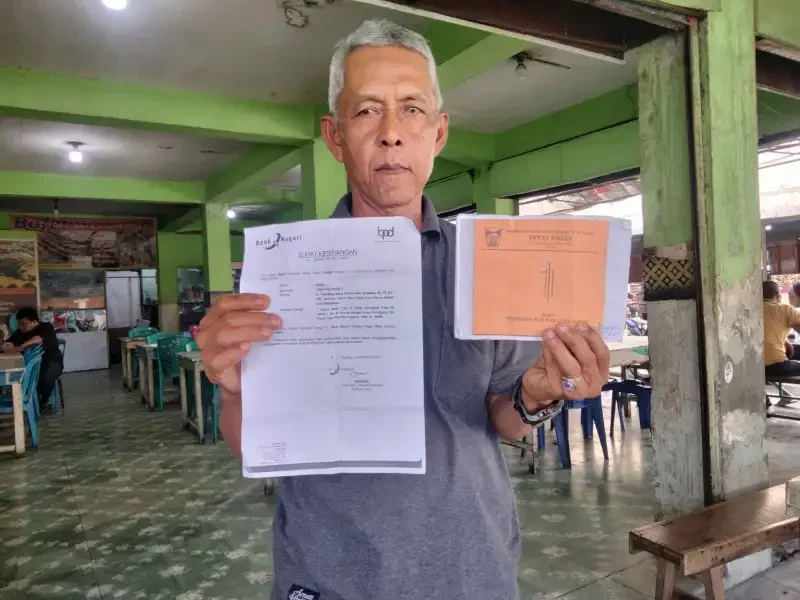pedagang-pasar-raya-padang-keluhkan-tak-dapat-toko-meski-miliki-kartu-kuning pedagang-pasar-raya-padang-keluhkan-tak-dapat-toko-meski-miliki-kartu-kuning